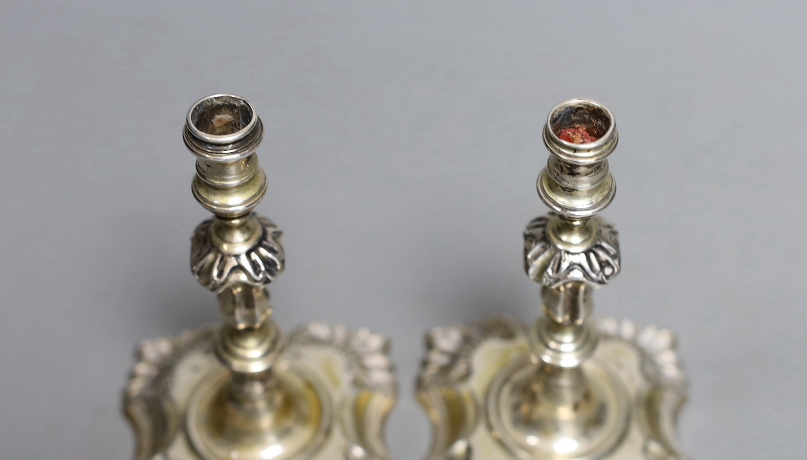 A pair of George V silver taper sticks, by Garrard & Co Ltd, London, 1934, 12.1cm, 10.7oz.